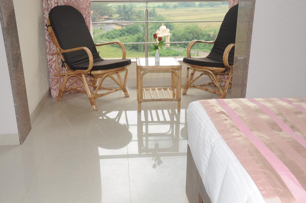Boshan Hotels Mapusa Værelse billede